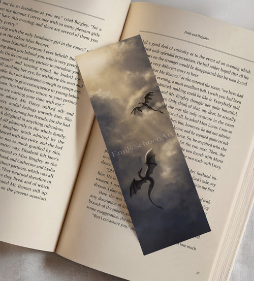 Bookmark of two dragons flying design on an open book